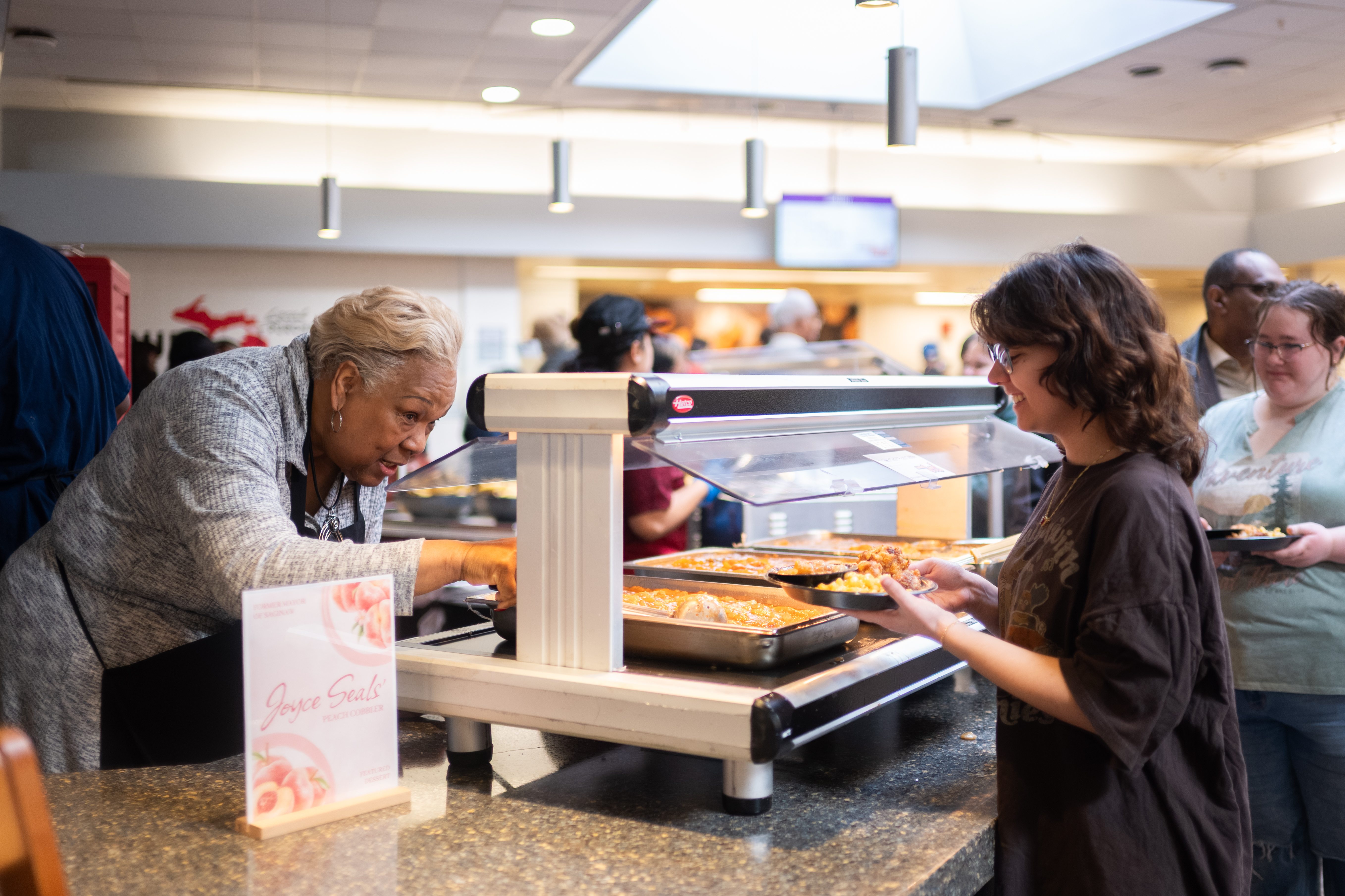 student taking food in the event